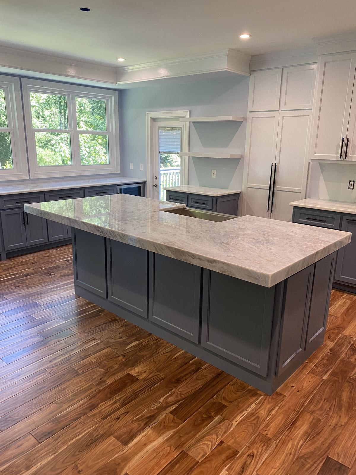 Australis Blue dolomite island with mitered waterfall edge installed in a Sugar Hill, GA kitchen
